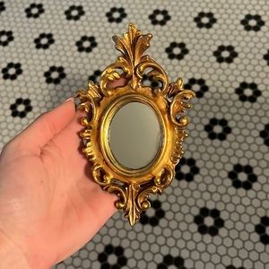 Gilt Florentine tiny gold ornate mirror made in Italy.